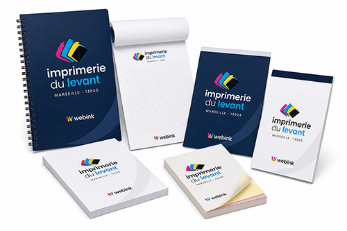 Carnets personnalisés pour entreprises et artisans fabriqués par l’Imprimerie du Levant à Marseille 13005, incluant carnets de notes, liasses, blocs autocopiants et carnets de chantier avec finition professionnelle Webink